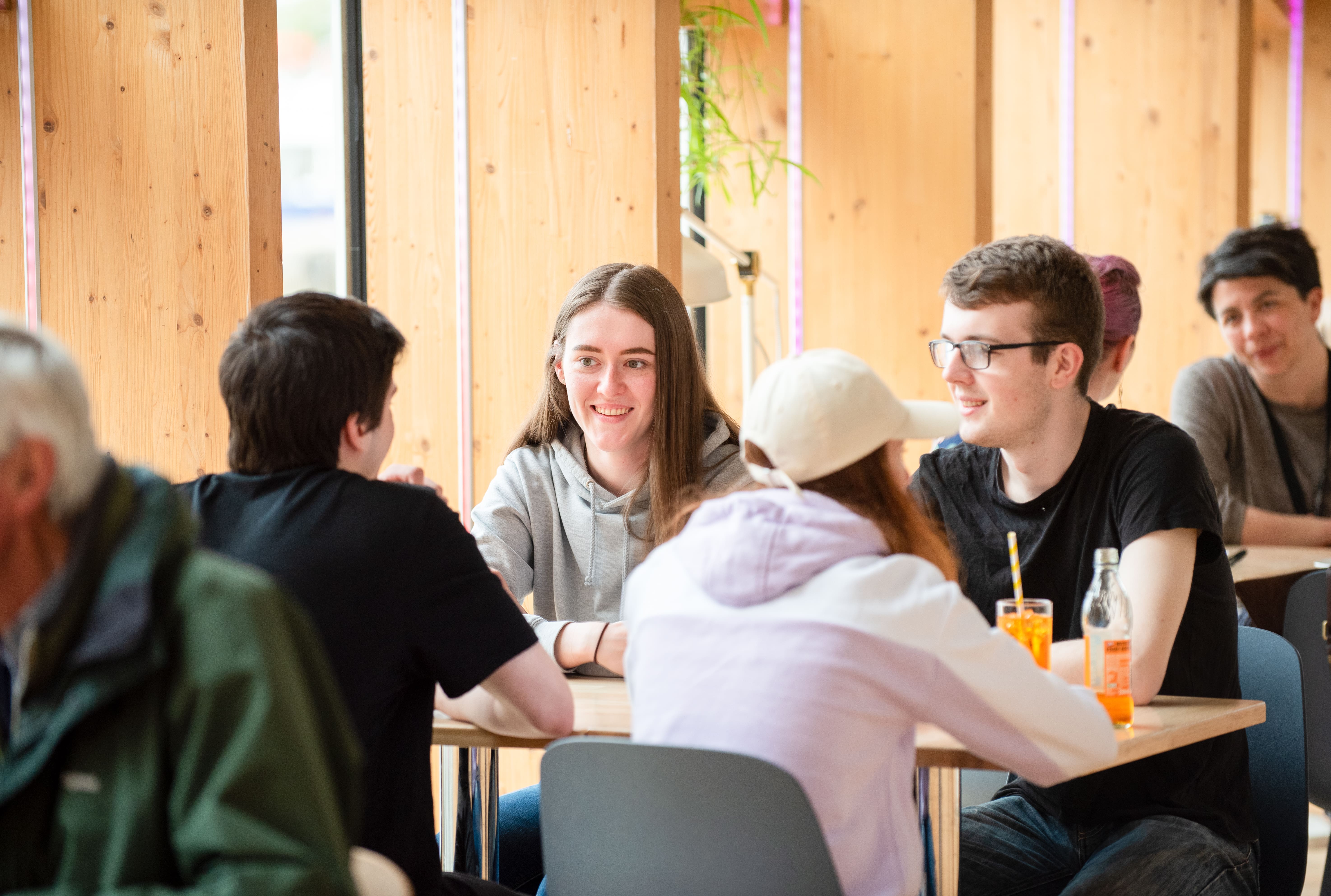 People sitting in a cafe talking