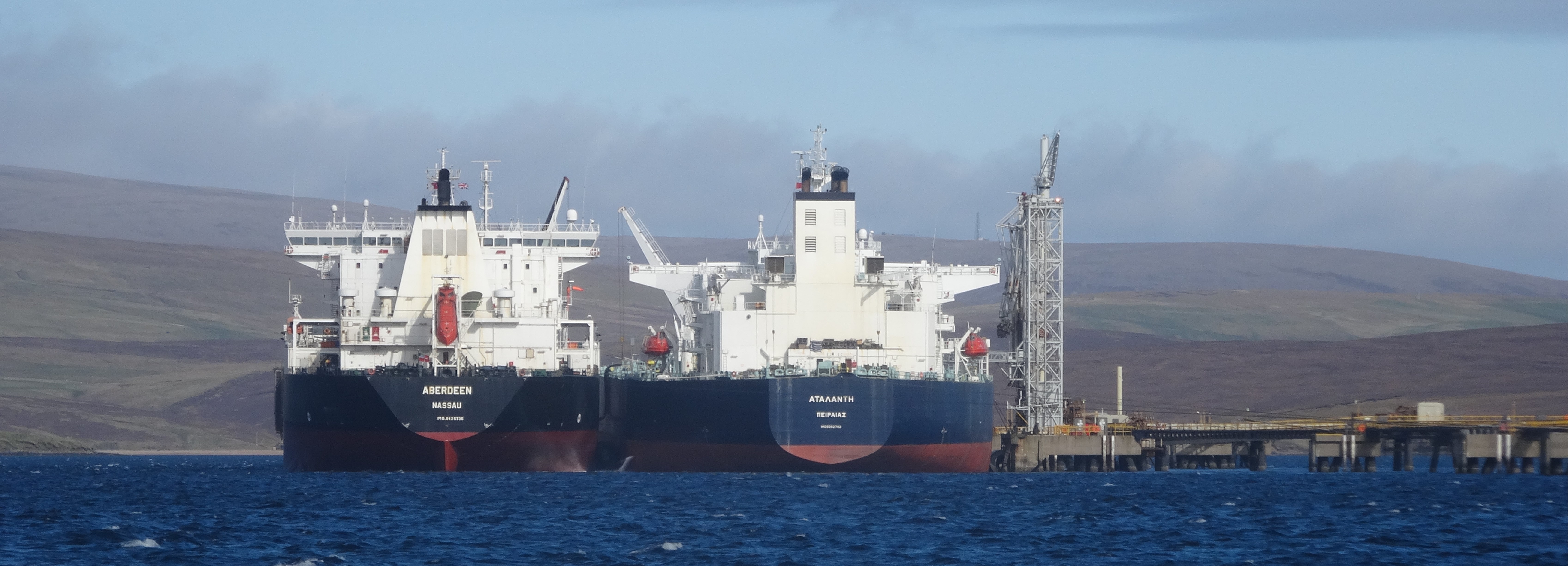 Two cargo vessels side by side