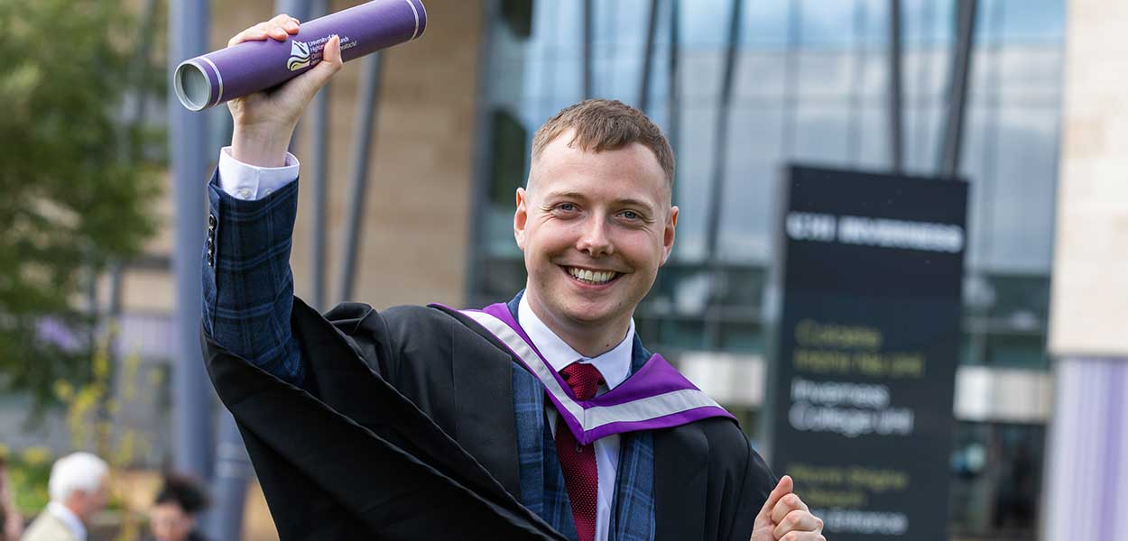 Geography graduate George Gunn at a graduation celebration at UHI Inverness